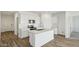 Contemporary kitchen featuring an island, modern appliances and sleek countertops at 5704 E Smeaton Pl, San Tan Valley, AZ 85140