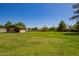 Large green backyard with storage shed and parking for recreational vehicle at 6637 W Pershing Ave, Glendale, AZ 85304
