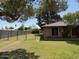 View of the backyard of this property with chain link fence and trees at 6637 W Pershing Ave, Glendale, AZ 85304