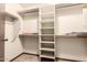 Well-organized walk-in closet with shelving and ample storage space at 6637 W Pershing Ave, Glendale, AZ 85304
