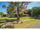 Charming single-story home with a well-maintained front lawn and mature shade trees at 6637 W Pershing Ave, Glendale, AZ 85304