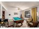 Bright game room featuring a pool table, ample seating, and a large window at 6637 W Pershing Ave, Glendale, AZ 85304