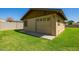 Garage with a brown exterior with grass yard at 6637 W Pershing Ave, Glendale, AZ 85304