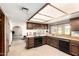 Functional kitchen layout with black appliances, ample counter space, and direct access to the dining area at 6637 W Pershing Ave, Glendale, AZ 85304