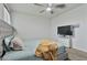 A spacious bedroom boasts a ceiling fan, tv, and soft neutral colors at 7812 W Payson Rd, Phoenix, AZ 85043