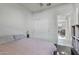Bright bedroom features carpet flooring, and a closet with white doors at 7812 W Payson Rd, Phoenix, AZ 85043