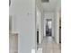 Hallway with tile flooring leads to various rooms, showing the home's layout and flow at 7812 W Payson Rd, Phoenix, AZ 85043