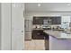 Modern kitchen featuring stainless steel appliances and granite countertops at 7812 W Payson Rd, Phoenix, AZ 85043