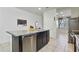 Kitchen island featuring a stainless steel dishwasher, faucet and a sink at 7812 W Payson Rd, Phoenix, AZ 85043