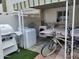 Outdoor patio with grill, washer, dryer, and various recreational items at 815 N Hayden Rd # B4, Scottsdale, AZ 85257