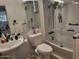Clean bathroom with sleek fixtures, glass shower door, and neutral tones at 815 N Hayden Rd # B4, Scottsdale, AZ 85257