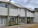 Townhouse exterior featuring tidy landscaping and neutral siding at 815 N Hayden Rd # B4, Scottsdale, AZ 85257