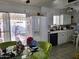 Functional kitchen with white cabinets, modern appliances, a view to the back patio and a cozy breakfast area at 815 N Hayden Rd # B4, Scottsdale, AZ 85257
