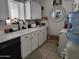 Well-lit kitchen featuring updated appliances, white cabinets, and a stylish black faucet at 815 N Hayden Rd # B4, Scottsdale, AZ 85257
