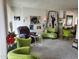 Bright living room with natural light, featuring unique decor, plush seating and a relaxing atmosphere at 815 N Hayden Rd # B4, Scottsdale, AZ 85257