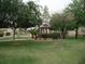 Community park with grassy lawns, shade trees, gazebo, and playground equipment at 815 N Hayden Rd # B4, Scottsdale, AZ 85257