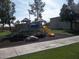 Community playground featuring a slide, climbing structure and black mulch at 815 N Hayden Rd # B4, Scottsdale, AZ 85257