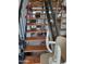 Unique staircase design, enhanced with mirrored accents and wood steps for a modern touch at 815 N Hayden Rd # B4, Scottsdale, AZ 85257