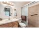 Well-lit bathroom featuring a vanity with solid surface countertops, a shower, and modern fixtures at 8241 N Central Ave # 2, Phoenix, AZ 85020