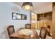 Cozy dining area showcasing a wooden table with seating and built-in cabinets at 8241 N Central Ave # 2, Phoenix, AZ 85020