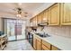 Bright kitchen featuring sliding glass doors to an outdoor patio area and tiled countertops at 8241 N Central Ave # 2, Phoenix, AZ 85020