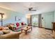Inviting living room with tile flooring, neutral walls, ceiling fan, and comfortable furnishings at 8241 N Central Ave # 2, Phoenix, AZ 85020