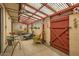 Enclosed patio with comfortable seating area, unique decor, and a covered overhead at 8241 N Central Ave # 2, Phoenix, AZ 85020