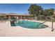 A refreshing community pool is surrounded by ample seating and mature trees, creating a serene outdoor space at 8241 N Central Ave # 2, Phoenix, AZ 85020