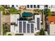 Overhead view of a backyard showcasing a sparkling pool, lush landscaping, and solar panels on the roof at 8637 E Via De La Escuela --, Scottsdale, AZ 85258