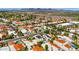 Panoramic aerial shot showcasing community homes with pools, mature trees, and stunning mountain views at 8637 E Via De La Escuela --, Scottsdale, AZ 85258