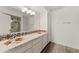 Bathroom with double sinks, ornate tile countertop, and a glass shower with orange and blue tile at 8637 E Via De La Escuela --, Scottsdale, AZ 85258