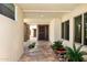 Inviting entryway with stone flooring, potted plants, and large windows for natural light at 8637 E Via De La Escuela --, Scottsdale, AZ 85258