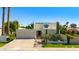 Beautiful contemporary home with desert landscaping, attached garage, and manicured lawn at 8637 E Via De La Escuela --, Scottsdale, AZ 85258