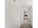 Bright hallway with white walls and carpet, connecting various rooms and featuring natural light at 8637 E Via De La Escuela --, Scottsdale, AZ 85258