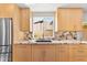 Bright kitchen featuring light wood cabinets, granite countertops, and stainless steel appliances at 8637 E Via De La Escuela --, Scottsdale, AZ 85258
