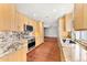 Bright kitchen with light wood cabinets, stainless steel appliances, and granite countertops at 8637 E Via De La Escuela --, Scottsdale, AZ 85258