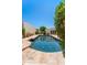 Backyard pool surrounded by lush greenery, creating a private and tranquil oasis for relaxation at 8637 E Via De La Escuela --, Scottsdale, AZ 85258