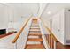 Bright staircase with white railings, wooden steps, and access to the main living area at 8637 E Via De La Escuela --, Scottsdale, AZ 85258