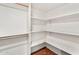 White walk-in closet with wood shelving at 8637 E Via De La Escuela --, Scottsdale, AZ 85258