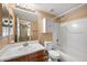 Clean bathroom with a combination tub and shower, a vanity with a sink, and an above-toilet cabinet at 9233 E Neville Ave # 1125, Mesa, AZ 85209