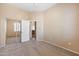 Bedroom with a mirrored sliding closet and doorway that leads to another room at 9233 E Neville Ave # 1125, Mesa, AZ 85209
