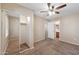 Bright bedroom featuring a ceiling fan, a closet with sliding mirror doors, and neutral colored carpet at 9233 E Neville Ave # 1125, Mesa, AZ 85209