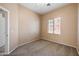 Bedroom with a large window and a ceiling fan at 9233 E Neville Ave # 1125, Mesa, AZ 85209