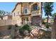 Two-story home with a desert-landscaped yard and a combination of stone and stucco exterior finishes at 9233 E Neville Ave # 1125, Mesa, AZ 85209