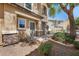 Inviting front entrance with a stone accent wall, desert landscaping, and a secure entrance door at 9233 E Neville Ave # 1125, Mesa, AZ 85209