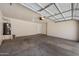 Spacious two-car garage featuring high ceilings and ample room for parking and storage at 9233 E Neville Ave # 1125, Mesa, AZ 85209