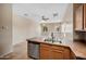 Modern kitchen with stainless steel appliances and a view into the living area at 9233 E Neville Ave # 1125, Mesa, AZ 85209