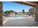 Relaxing community pool surrounded by comfortable lounge chairs and shaded cabanas at 9233 E Neville Ave # 1125, Mesa, AZ 85209