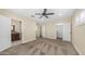 Spacious main bedroom with carpet, ample natural light, and multiple closets providing plenty of storage at 1001 W Northern Ave, Phoenix, AZ 85021