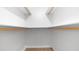 Walk-in closet with wood supports and shelving providing ample storage space at 1001 W Northern Ave, Phoenix, AZ 85021